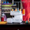 imageBrother Serger 1034D HeavyDuty Metal Frame Overlock Machine 1300 Stitches Per Minute Removeable Trim Trap 3 Included Accessory Feet White1034D
